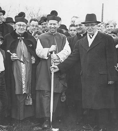 Catholic leaders with a shovel for the groundbreaking ceremony